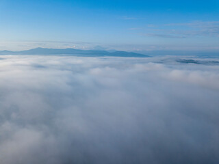 Morning fog in the Ukrainian Carpathians. Aerial drone view.