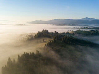 Morning fog in the Ukrainian Carpathians. Aerial drone view.