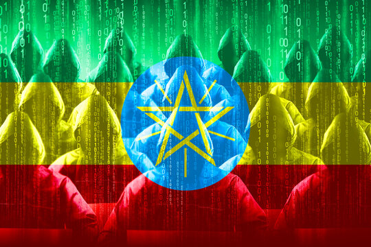 Anonymous hooded hackers, flag of Ethiopia, binary code - cyber attack concept