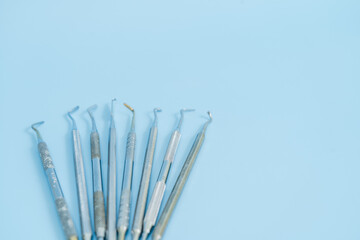 Dentist tool set. Teethcare, dental health concept. Blue background top view copy space