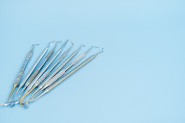 Dentist tool set. Teethcare, dental health concept. Blue background top view copy space