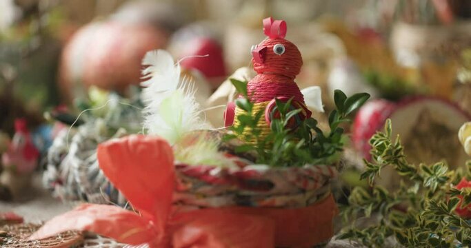 Easter centerpiece in spring colors made by hand - a colorful hen.