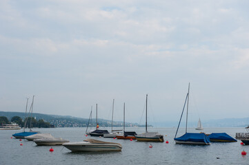 Fototapeta na wymiar Boats and buoys on the Zurich lake