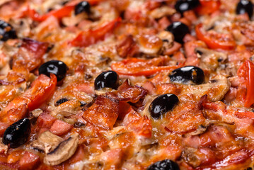 Homemade vegetable pizza with addition of tomatoes, olives and herbs
