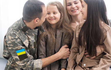 Happy Ukrainian soldier in military, cheerful daughter, Ukrainian veterans of Russian-Ukrainian,...