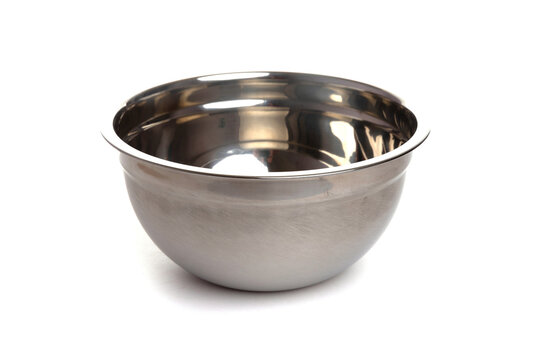large polished metal salad bowl on a white isolated background
