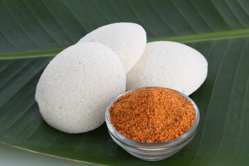 Idly , Idli is a traditional breakfast of South India served on banana leaf