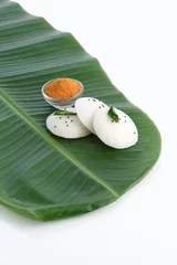 Fotobehang Idly , Idli is a traditional breakfast of South India served on banana leaf © SMD IMAGES