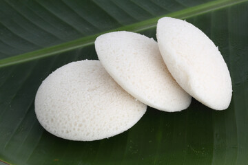 Idly , Idli is a traditional breakfast of South India served on banana leaf