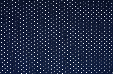 Close up blue fabric have white circle texture. clothes background.