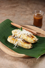 Pisang Gapit or pisang Epe is Grilled banana with coconut brown sugar sauce