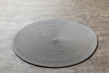 Perspective view of round tablecloth for food on cement background. Empty space for your design