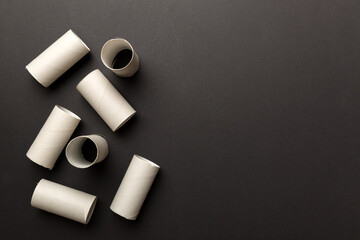 Flat lay composition with empty toilet paper rolls and space for text on color background. Recyclable paper tube with metal plug end made of kraft paper or cardboard