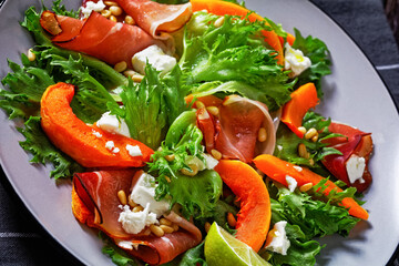 pumpkin salad with lettuce, crumbled cheese, ham