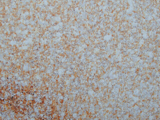 Background. shot of rusty metal. Rusty sheet of metal painted with paint. Rust seeping through white paint.