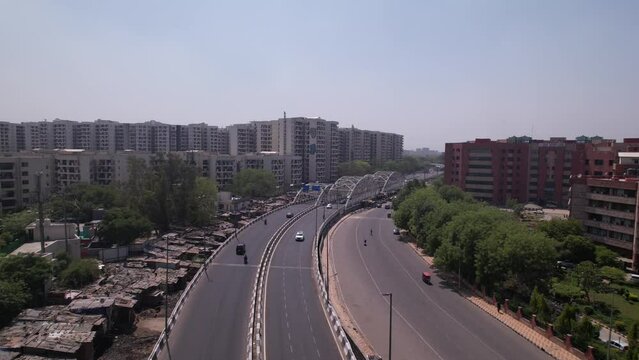 An aerial shot of the Traffic movement at Barah Pulla flyover in New Delhi, India 
