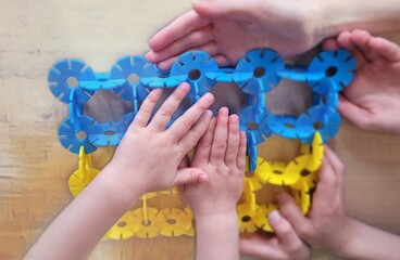 hands with puzzle - Save Ukraine