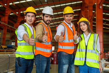 Team Foreman or Team worker work at factory site check up machine or products in site. Team...