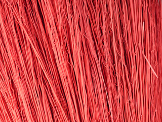 The texture of a large number of dried stems of a shrub folded together. Red color. Closeup