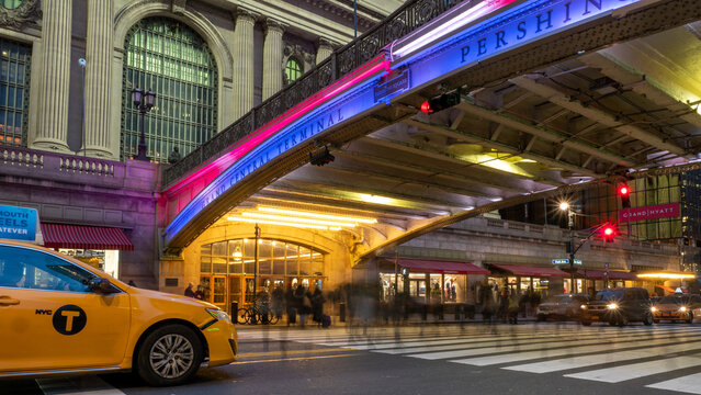 NEW YORK CITY - November 14, 2019: Pershing Square entrance to Grand Central Terminal. Commuters rush home on crosswalk into Grand Central on their way home in the evening.