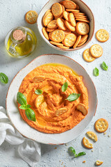 Traditional and delicious tomato hummus made of healthy ingredients.