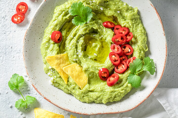 Fresh and delicious guacamole as a spicy mexican appetizer.