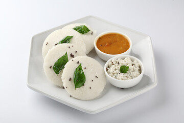 south indian food, IDLY WITH SAMBAR ,COCONUT CHUTNEY, served in a ceramic plate 