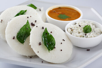 south indian food, IDLY WITH SAMBAR ,COCONUT CHUTNEY, served in a ceramic plate 