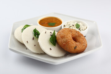 South Indian Breakfast menu, Idly Vadai with coconut chutney and sambar, served in a white Ceramic plate