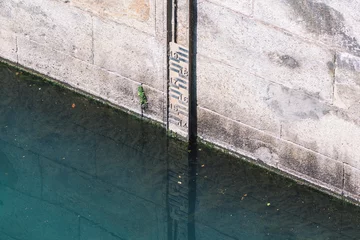 Foto auf Alu-Dibond River water level meter in Torino, Italy, Po river, drought concept © Michele Ursi