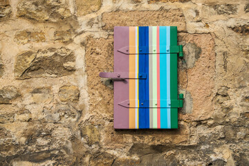 colorful wooden shutter in a vintage wall in Backnang, Germany