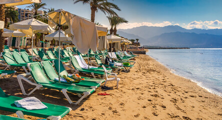Morning on sandy beach in Eilat - famous tourist resort and recreational city in Israel