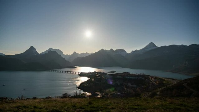 Timelapse of the sun going behind the mountain at sunset in Ria&ntilde;o, Spain