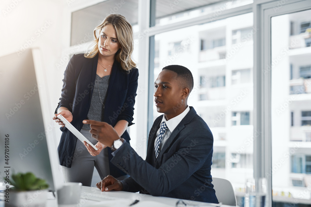 Poster keeping a close eye on the smooth-running of their plans. shot of two businesspeople working togethe