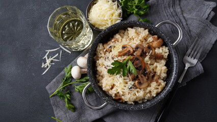 Mushroom risotto garnished with parsley  and parmesan.