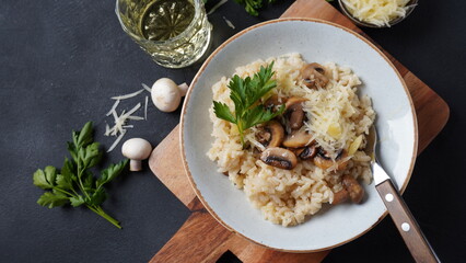 Mushroom risotto garnished with parsley  and parmesan.