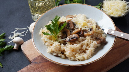 Mushroom risotto garnished with parsley  and parmesan.