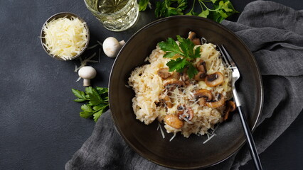 Mushroom risotto garnished with parsley  and parmesan. © Natalia Hanin