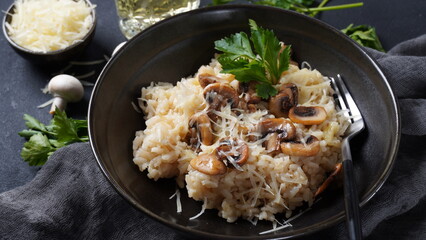 Mushroom risotto garnished with parsley  and parmesan.