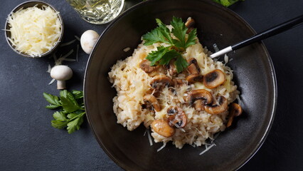 Mushroom risotto garnished with parsley  and parmesan.