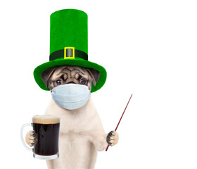 St Patrick's Day during lockdown concept. Funny puppy wearing protective face mask and green...