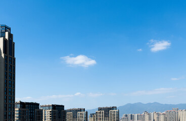 Modern city buildings under blue sky