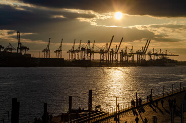 Fototapeta na wymiar Hamburg, Germany: Harbor scenery at sunset