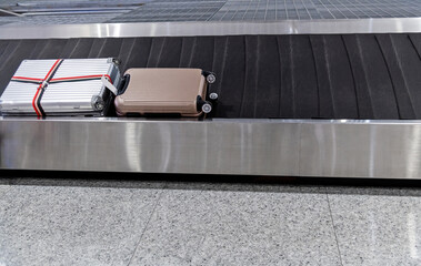Single suitcase on conveyor belt at the airport