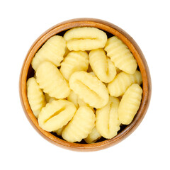Raw gnocchi, Italian dumplings, in a wooden bowl. Made of small lumps of dough, with ridges in the size of a thumb. Composed of potato and ordinary wheat flour, ready to boil or to fry in a pan. Photo