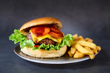 hamburger with french fries on chalkboard background