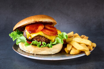 hamburger with french fries on chalkboard background
