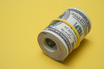 Dollars rolled up into a tube.