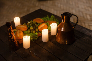 Lanterns on table with beer. candlesticks and beer on a wooden old table.