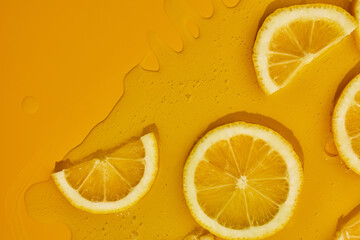 Top view of fresh slice lemons juice and gel serum, organic cosmetics, vitamin C, fresh citrus...